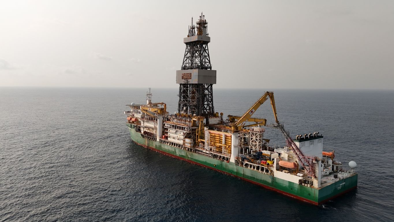 Drillship at anchor on open water