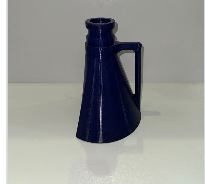 Tapered suction nozzle for reaching recesses and crevices