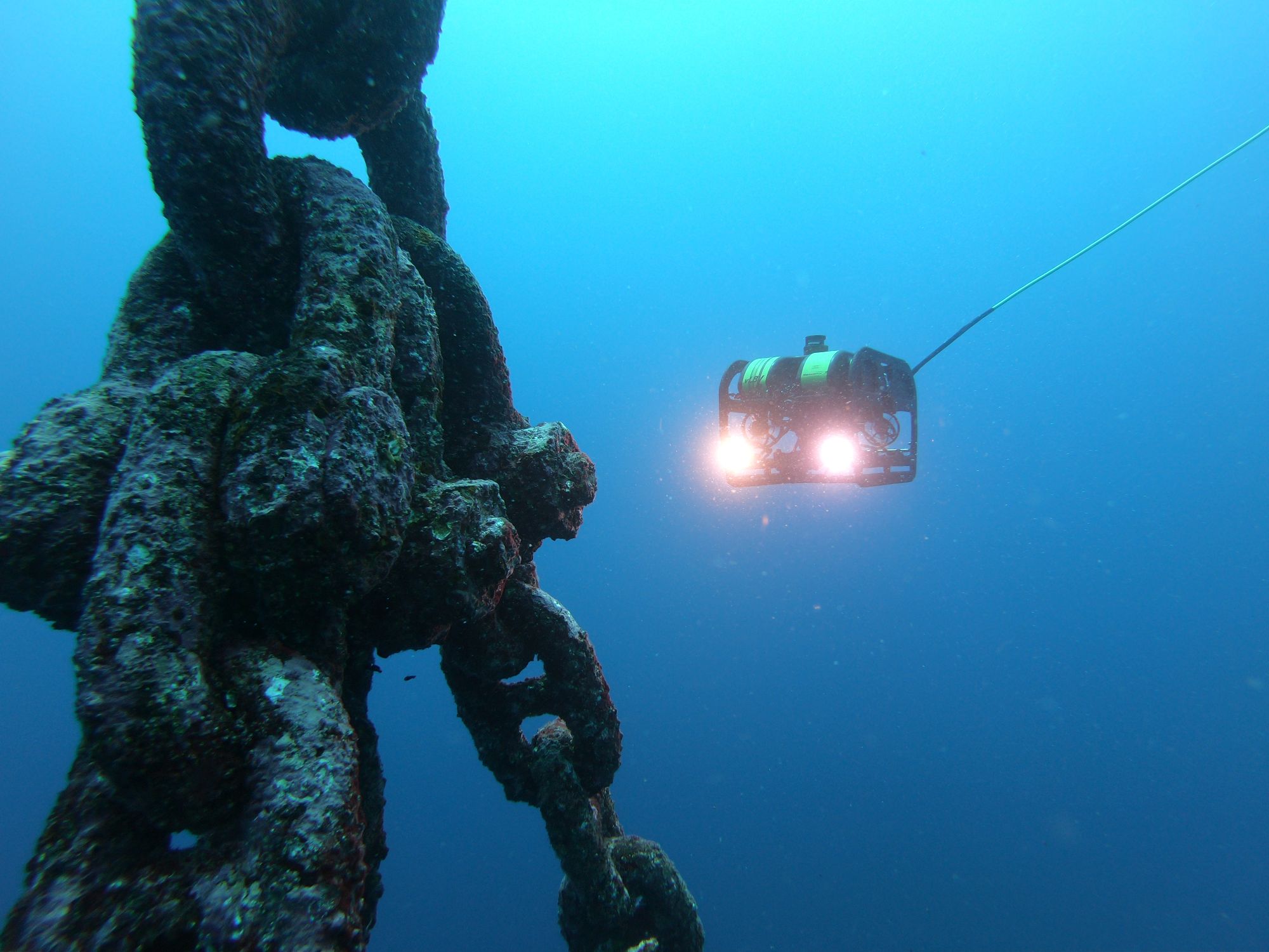 Inspection ROV approaching a fouled mooring chain underwater