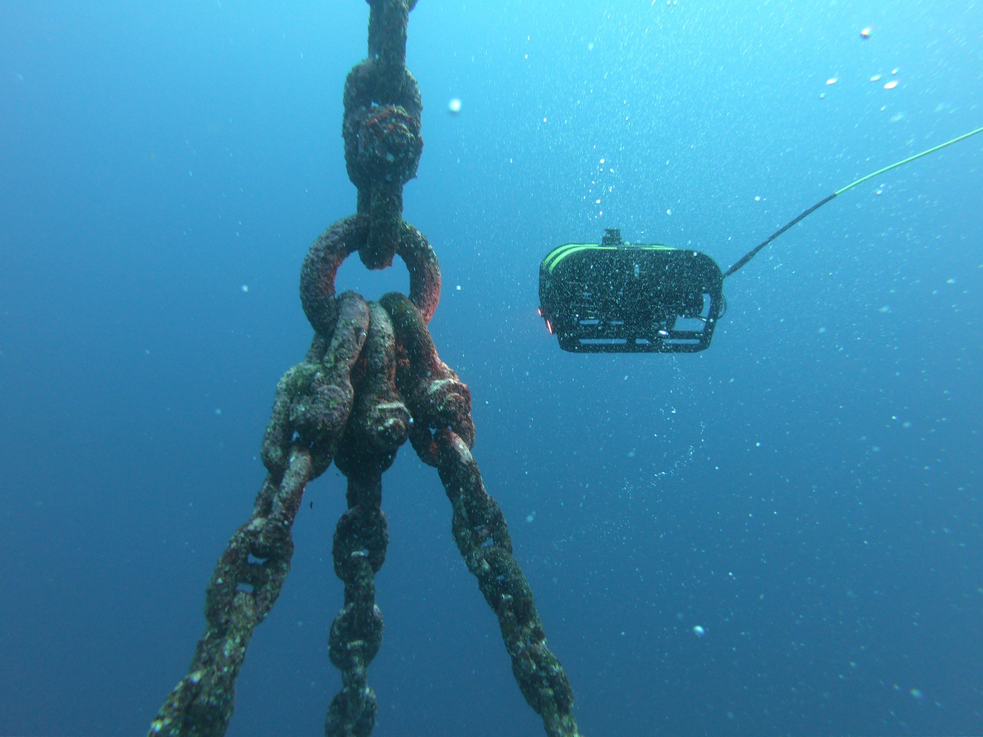 Inspection ROV beside a fouled mooring chain