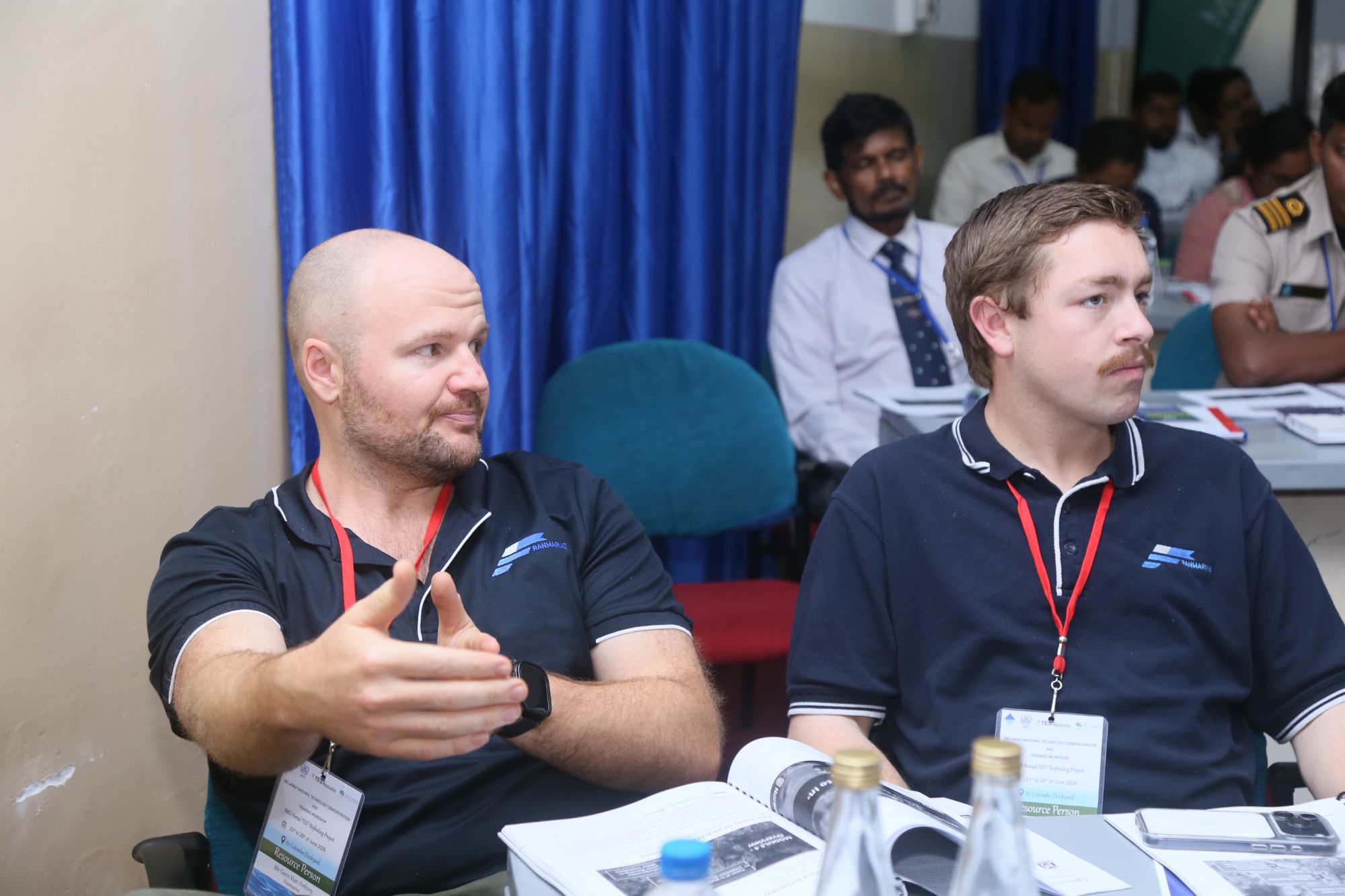 Trainees working through course material at a training workshop